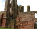 The first monks were a family of grey-robed Tironensian monks from Kelso.