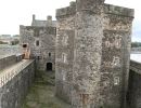 A stand alone prison inside a thick walled fortress.