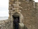 Peter walking into the interior of the wall.