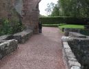 Me standing at the end of a stone bridge/path, the castle is behind me. People still there.