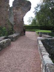 Me standing at the end of a stone bridge/path, the castle is behind me. People still there.