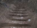 Stairs carved into the rock of the tunnel.