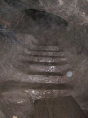 Stairs carved into the rock of the tunnel.